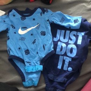 2 newborn Nike onesies